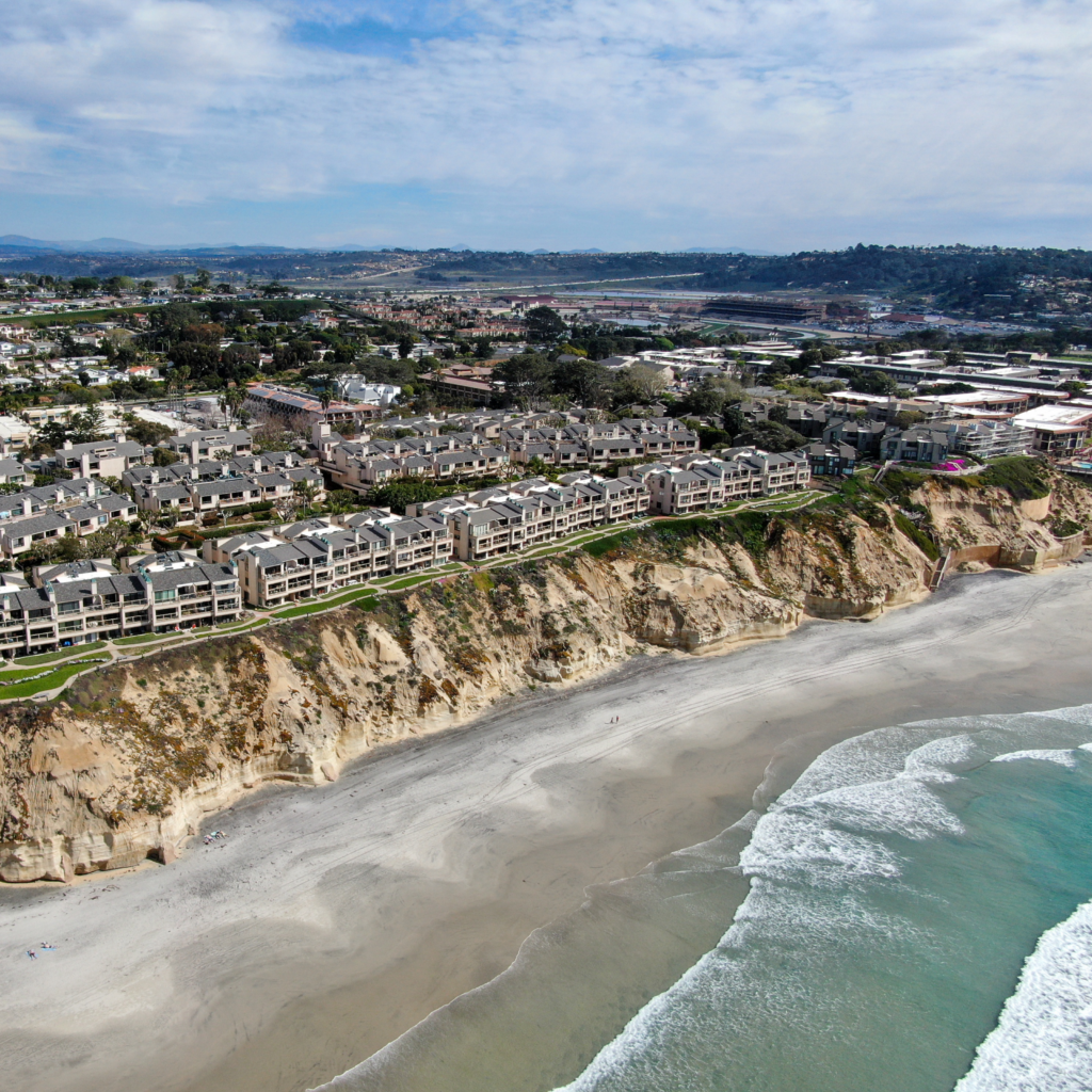 Realtor reviewing home insurance details with clients during a California real estate transaction