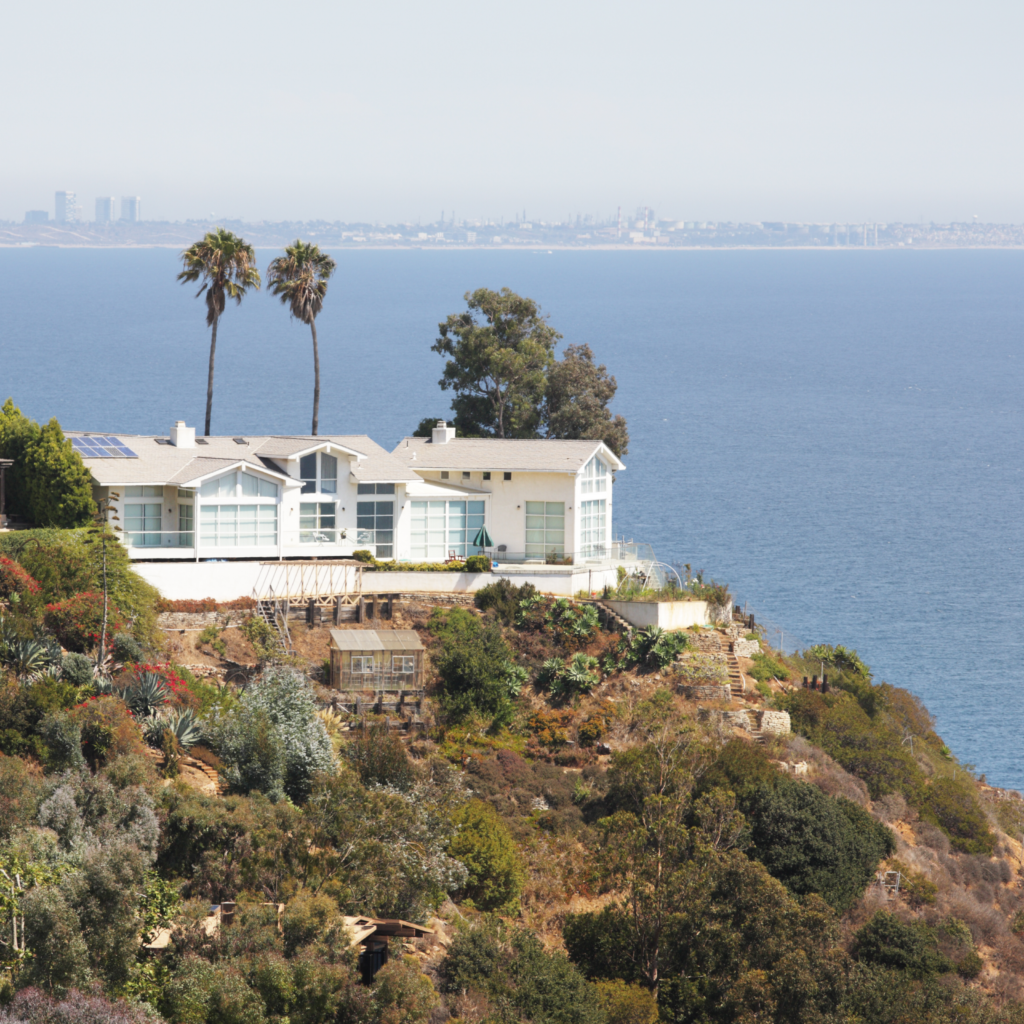 Realtor reviewing home insurance details with clients during a California real estate transaction
